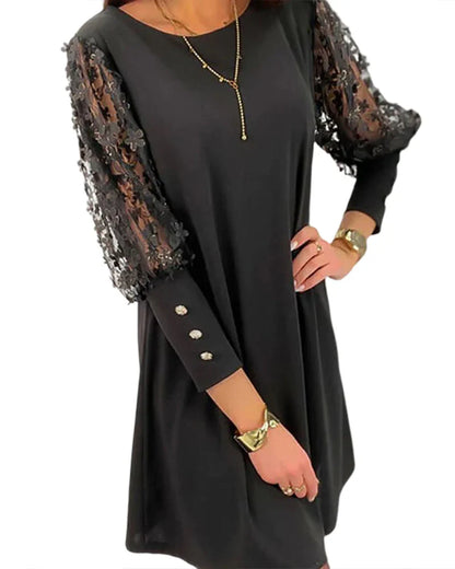 Elegante jurk met kanten mouwen en een losse pasvorm