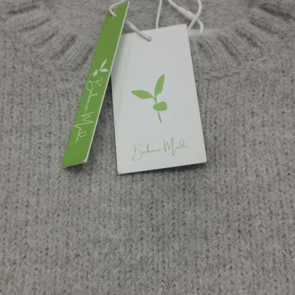 Oversized trui met ivoorkleurige voorzak en grote diepe zakken voor dames