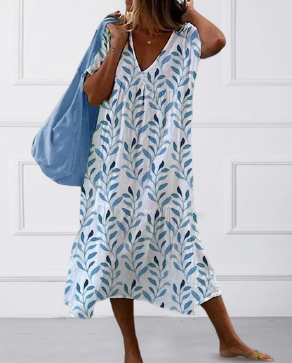 Boho midi-jurk met bladprint en vloeiende snit